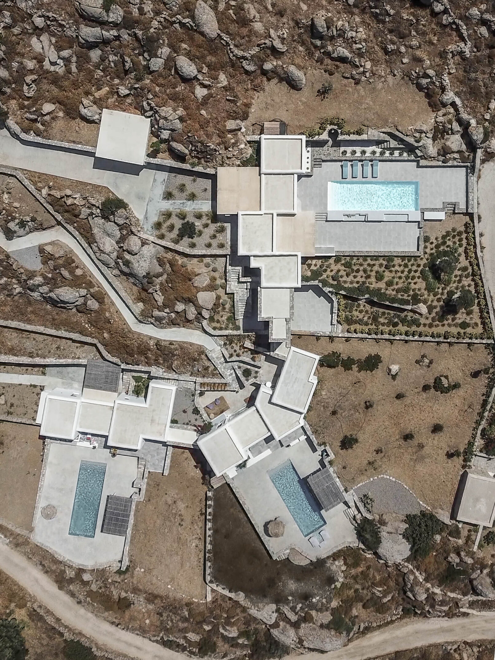Pinthos Architects Naxos vacation summer house - villa. Cycladic island design in Aegean. Aerial view with drone