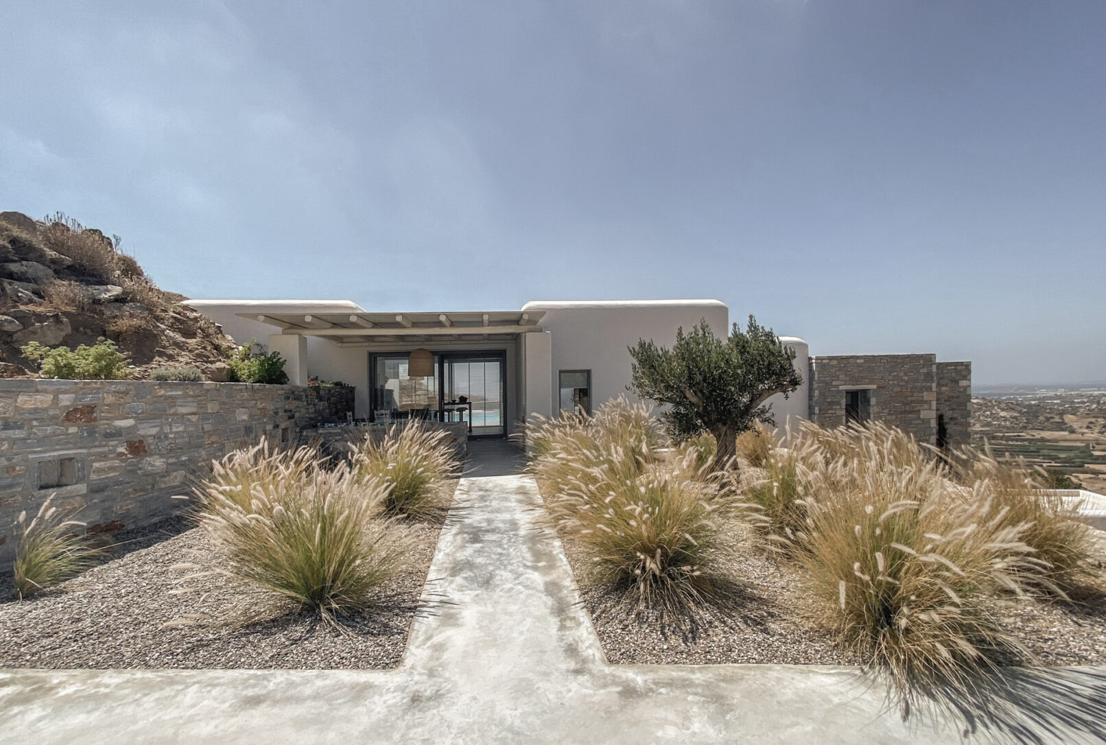Pinthos Architects Naxos vacation summer house - villa. Cycladic island design in Aegean. Architecture entrance