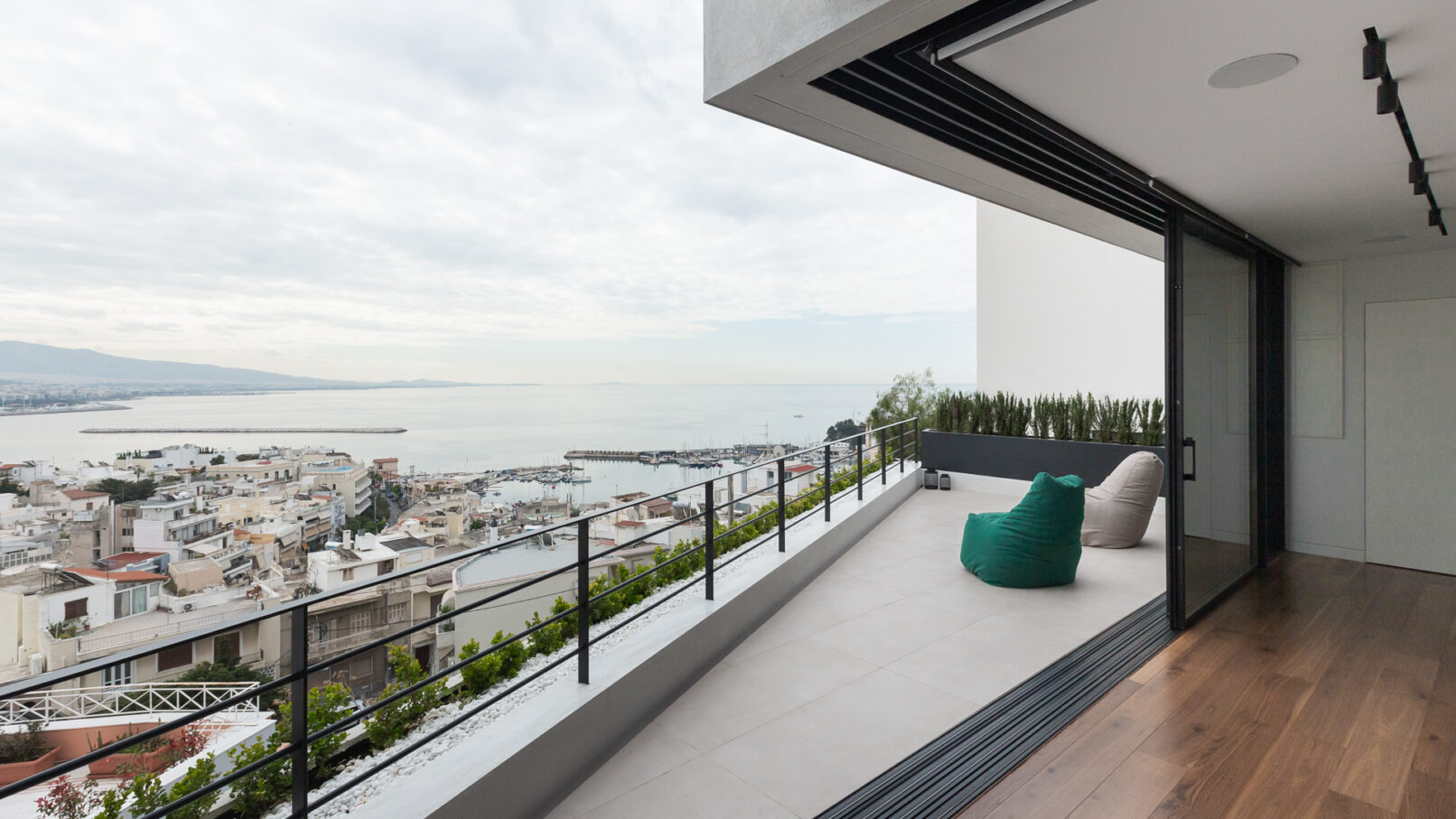 Elegant standalone residence in Kastella Hill, Piraeus, beautifully integrated into the steep terrain with multi-level design that maximizes sea views and privacy