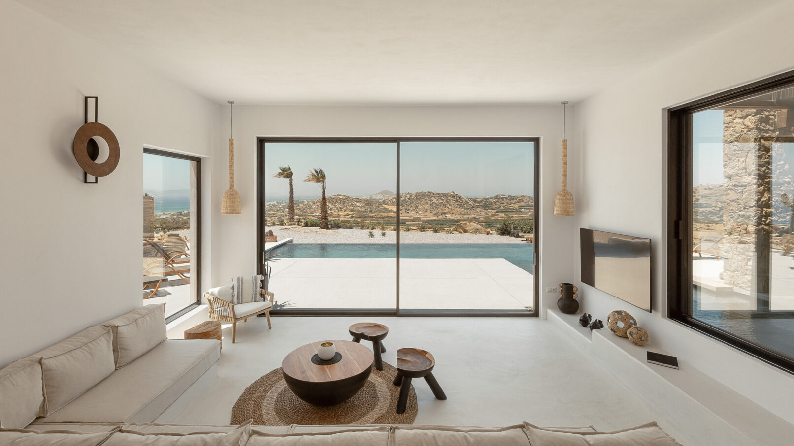 La Punta Villa in Naxos by PLINTHOS Architects: Cycladic architecture with stone, plaster, bioclimatic design, and stunning Aegean views.