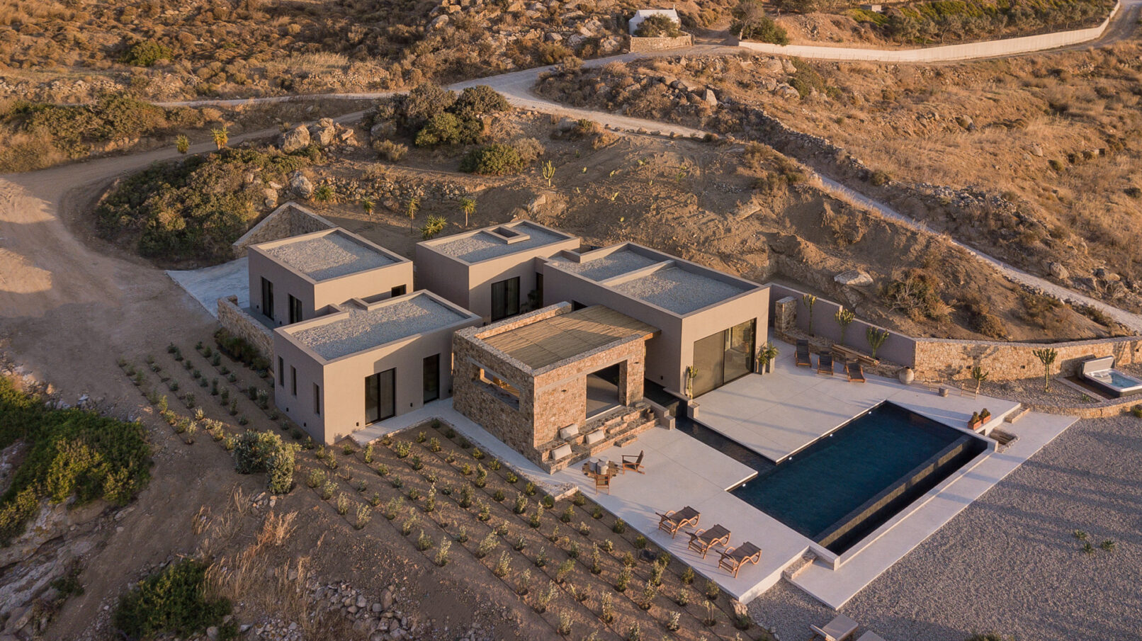 La Punta Villa in Naxos by PLINTHOS Architects: Cycladic architecture with stone, plaster, bioclimatic design, and stunning Aegean views.