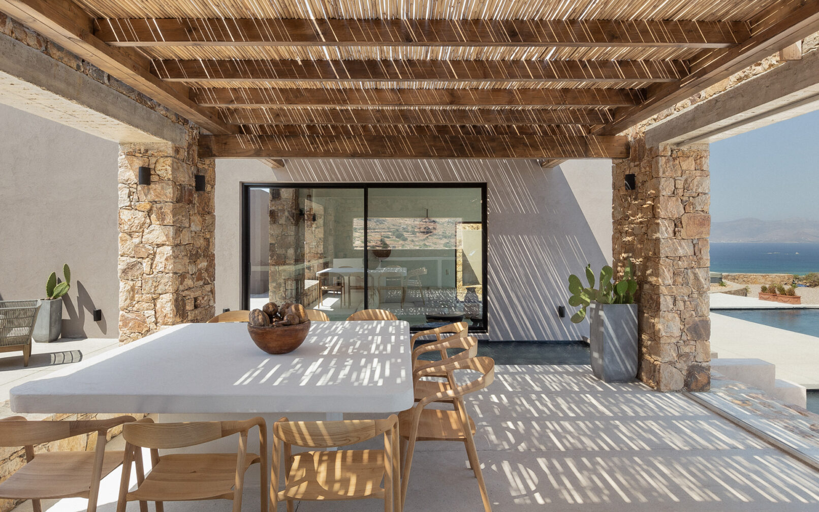 La Punta Villa in Naxos by PLINTHOS Architects: Cycladic architecture with stone, plaster, bioclimatic design, and stunning Aegean views.