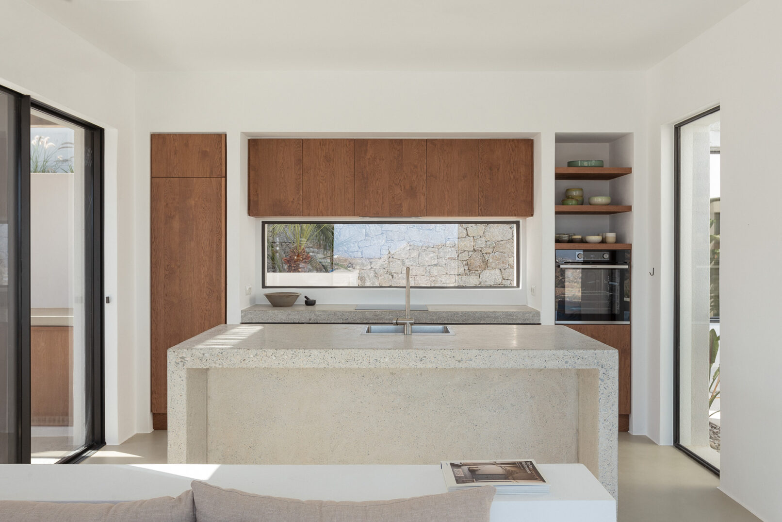 Discover La Natura Villas, an exclusive complex of luxury vacation homes in Naxos, designed by PLINTHOS Architects to blend seamlessly with the Cycladic landscape and offer breathtaking Aegean views.