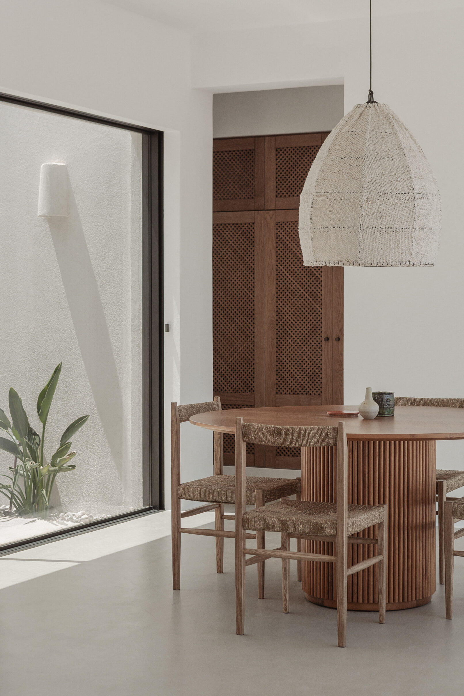 Discover La Natura Villas, an exclusive complex of luxury vacation homes in Naxos, designed by PLINTHOS Architects to blend seamlessly with the Cycladic landscape and offer breathtaking Aegean views.