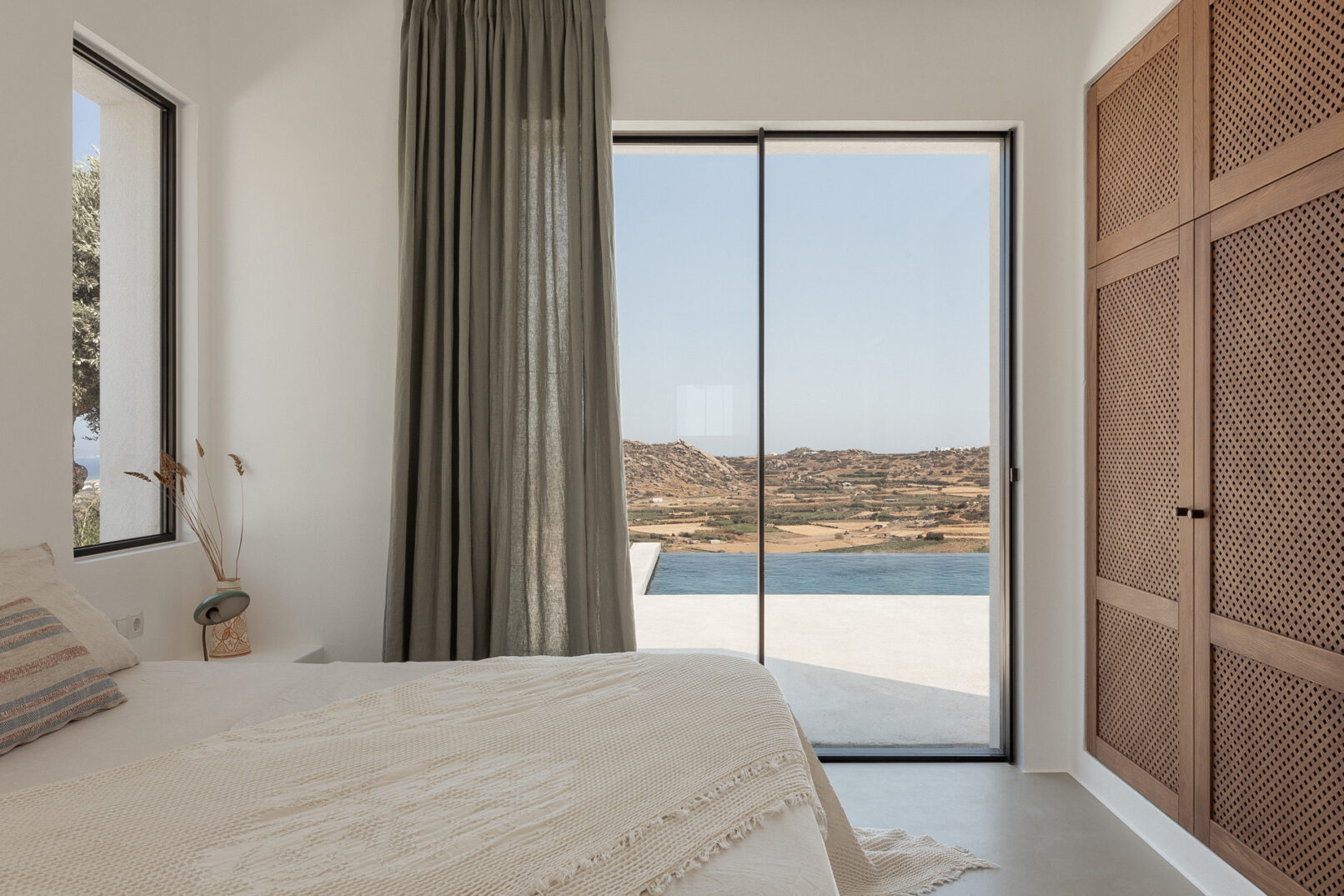 Discover La Natura Villas, an exclusive complex of luxury vacation homes in Naxos, designed by PLINTHOS Architects to blend seamlessly with the Cycladic landscape and offer breathtaking Aegean views.