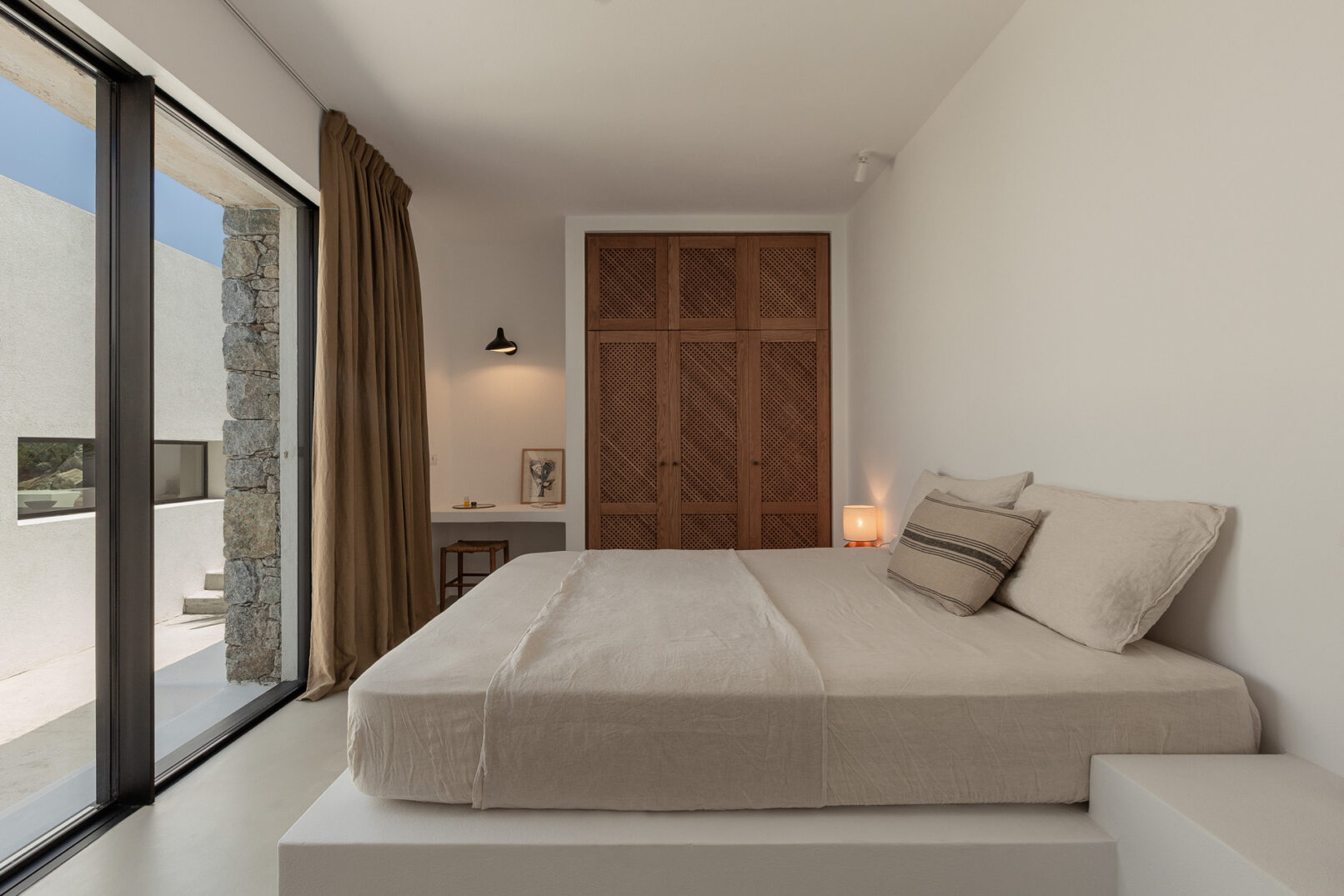 Discover La Natura Villas, an exclusive complex of luxury vacation homes in Naxos, designed by PLINTHOS Architects to blend seamlessly with the Cycladic landscape and offer breathtaking Aegean views.