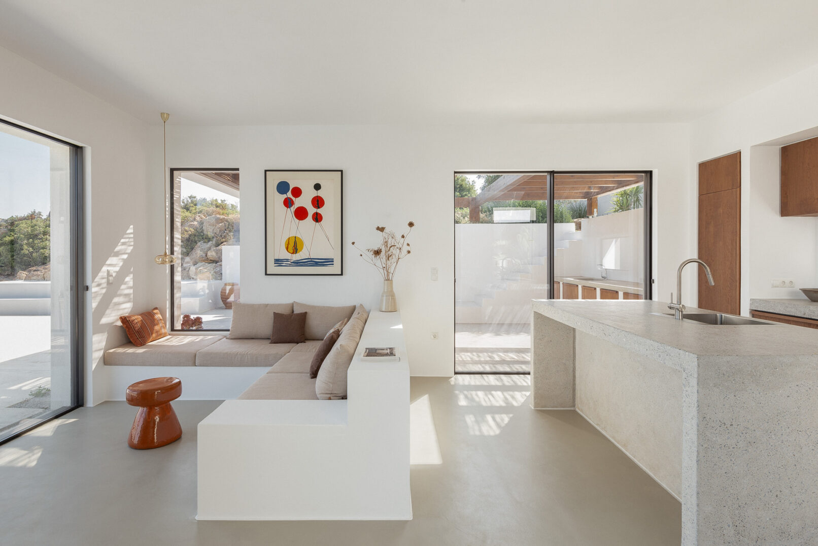 Discover La Natura Villas, an exclusive complex of luxury vacation homes in Naxos, designed by PLINTHOS Architects to blend seamlessly with the Cycladic landscape and offer breathtaking Aegean views.