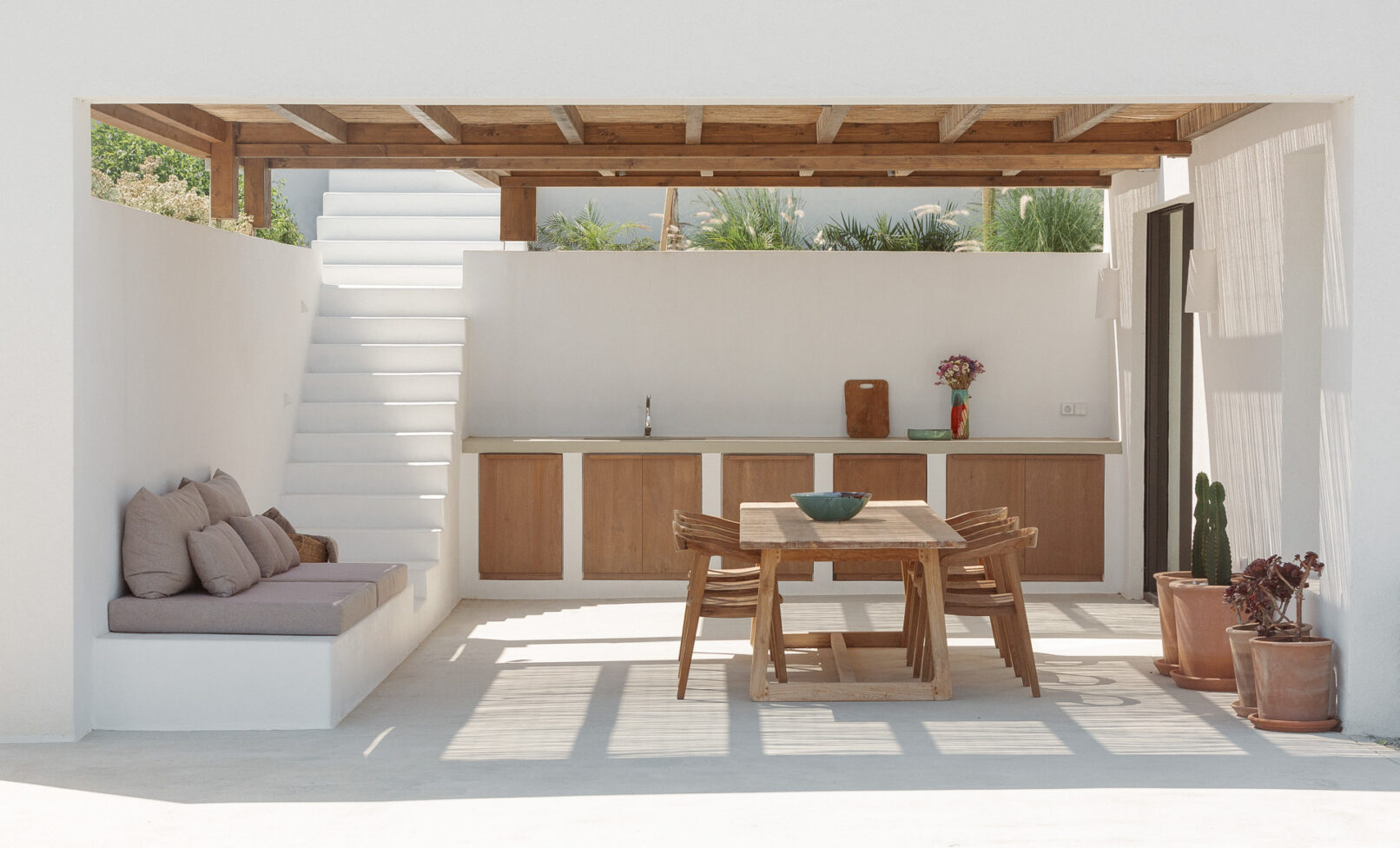 Discover La Natura Villas, an exclusive complex of luxury vacation homes in Naxos, designed by PLINTHOS Architects to blend seamlessly with the Cycladic landscape and offer breathtaking Aegean views.