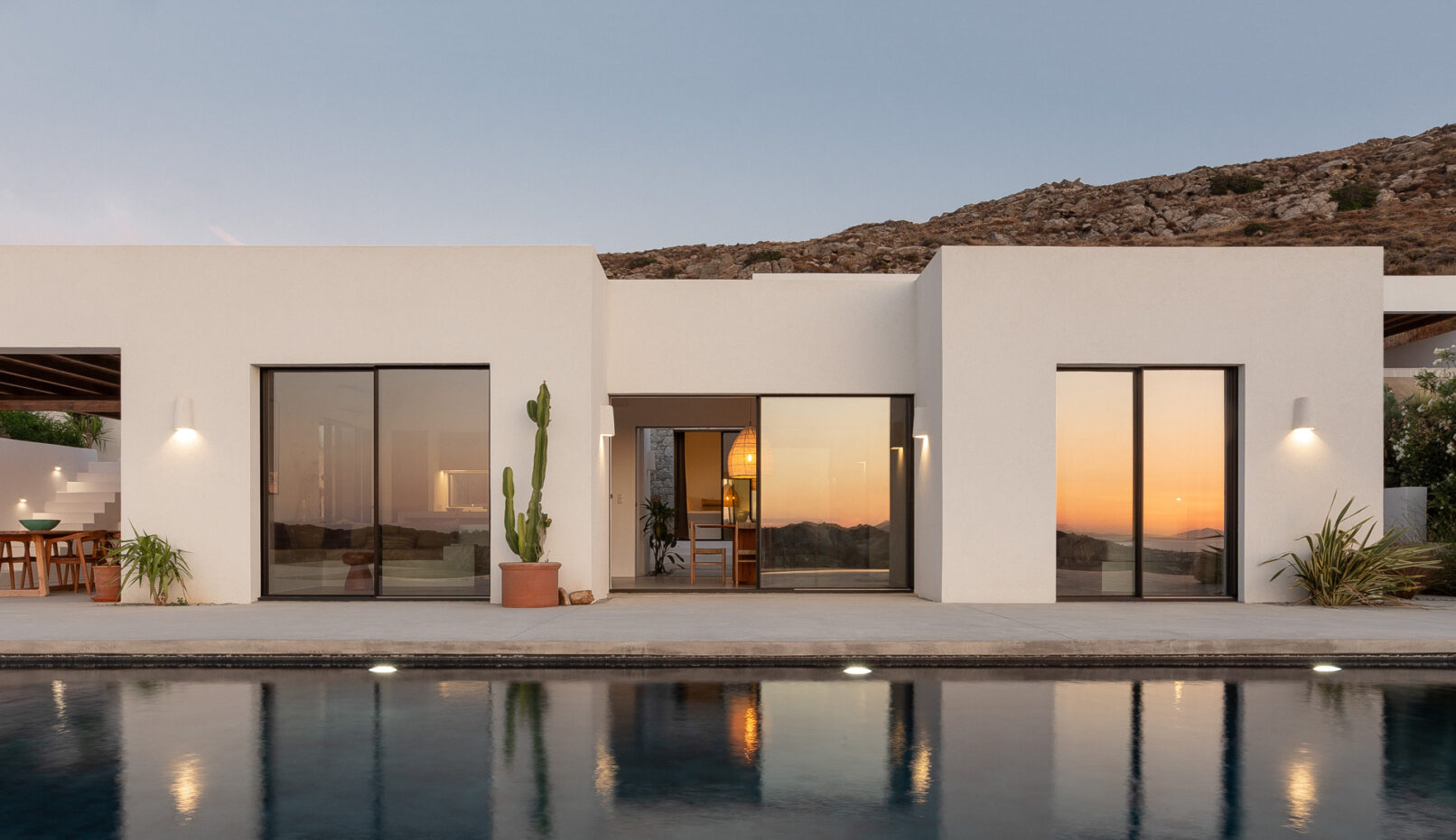 Discover La Natura Villas, an exclusive complex of luxury vacation homes in Naxos, designed by PLINTHOS Architects to blend seamlessly with the Cycladic landscape and offer breathtaking Aegean views.