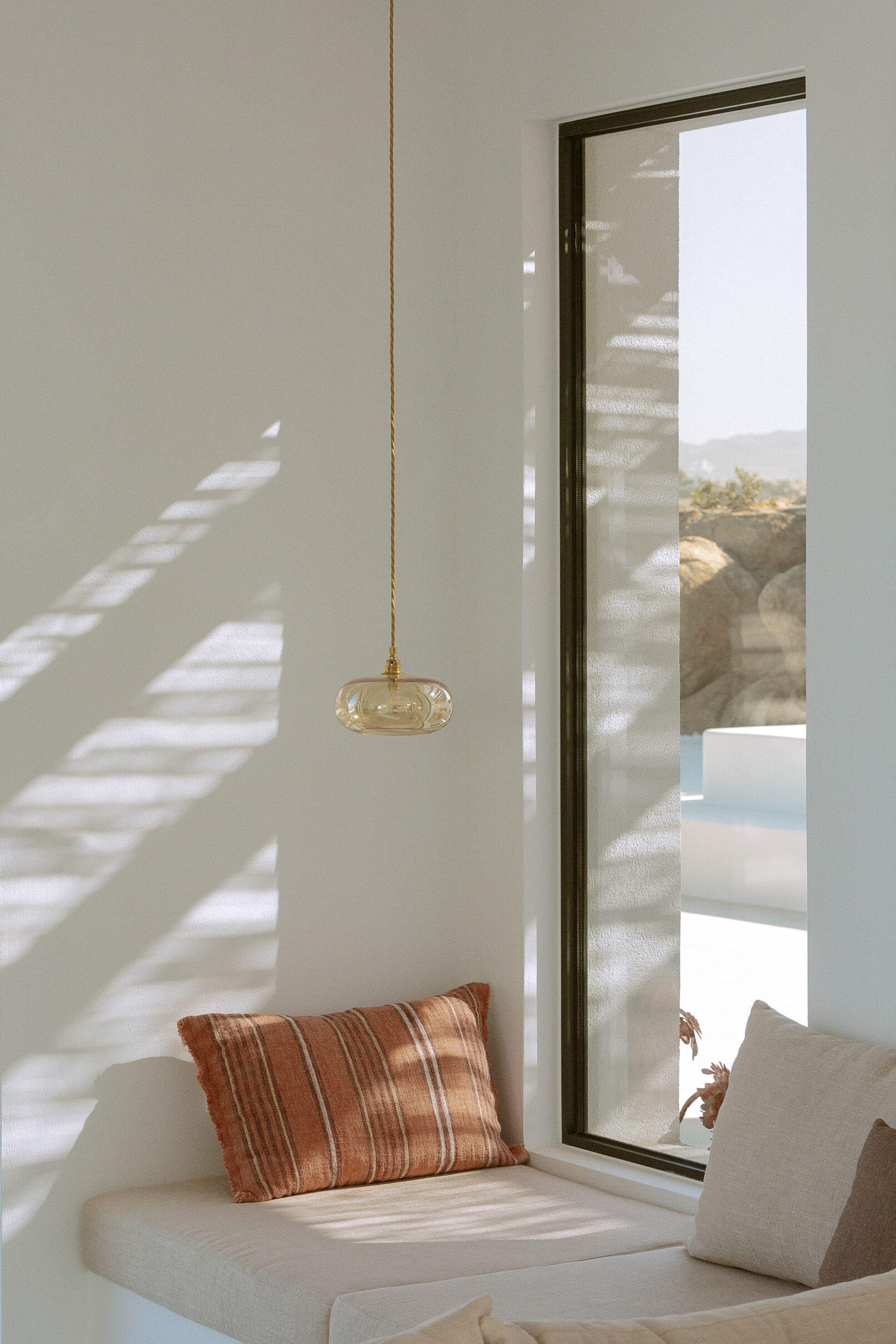 Discover La Natura Villas, an exclusive complex of luxury vacation homes in Naxos, designed by PLINTHOS Architects to blend seamlessly with the Cycladic landscape and offer breathtaking Aegean views.
